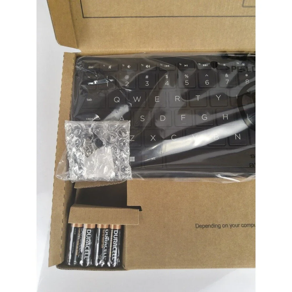 Slim Keyboard and wireless mouse Never used still in box with plastic